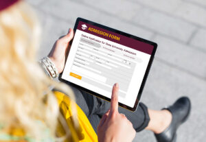 A potential student filling out a college application form.