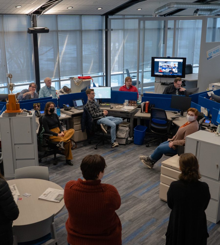 Post Buletin newsroom staff take part in a daily afternoon meeting Thursday, Dec. 8, 2022, in Rochester.